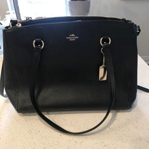 Coach satchel with top handles and removable shoulder strap.